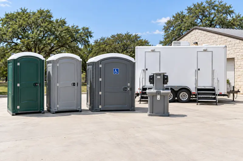 Standard and accessible portable toilets with handwashing and a restroom trailer